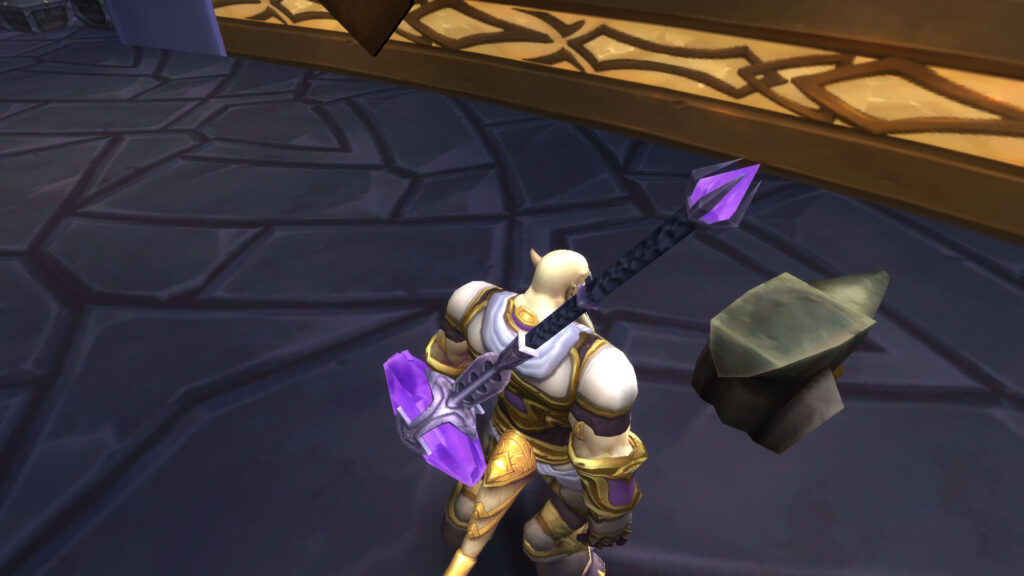 WoW draenei looks at the anvil